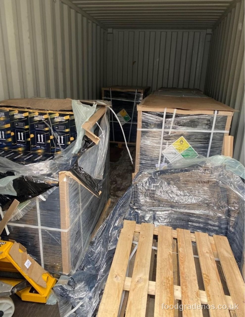 Palletised food-grade nitrous oxide stock inside a shipping container at the Whipped Cream Canada facility